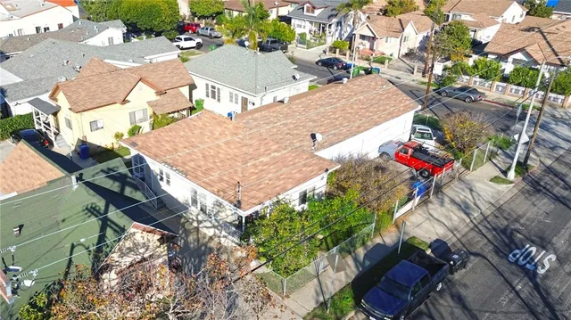 an aerial view of houses with outdoor space