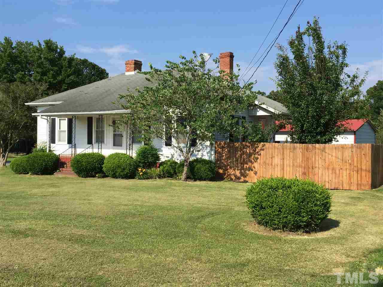 1953 Old Durham Road Roxboro, NC 27573 - Photo 1 of 10 a view of a house with a yard