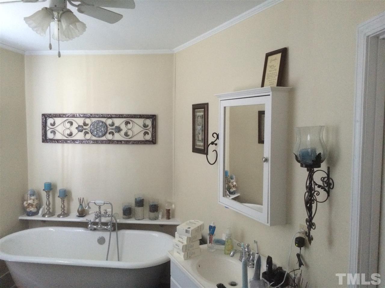 1953 Old Durham Road Roxboro, NC 27573 - Photo 10 of 10 a bathroom with a sink and a mirror