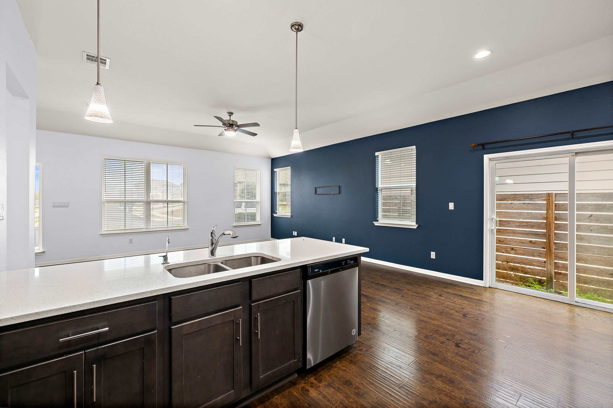 706 Coconut Grove Street Pflugerville, TX 78660 - Photo 13 of 23 The large kitchen island offers plenty of space for meal prep, casual dining, or morning coffee while staying connected to the heart of the home.