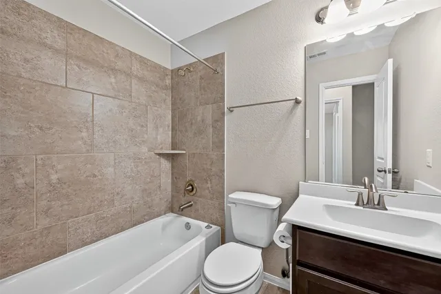 a bathroom with a tub and shower