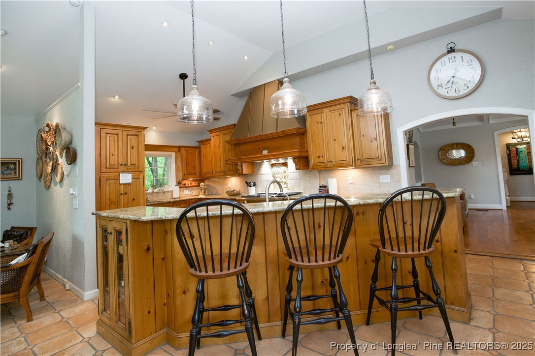 200 Cameron Avenue Vass, NC 28394 - Photo 11 of 50 a view of a dining room with furniture a chandelier and wooden floor