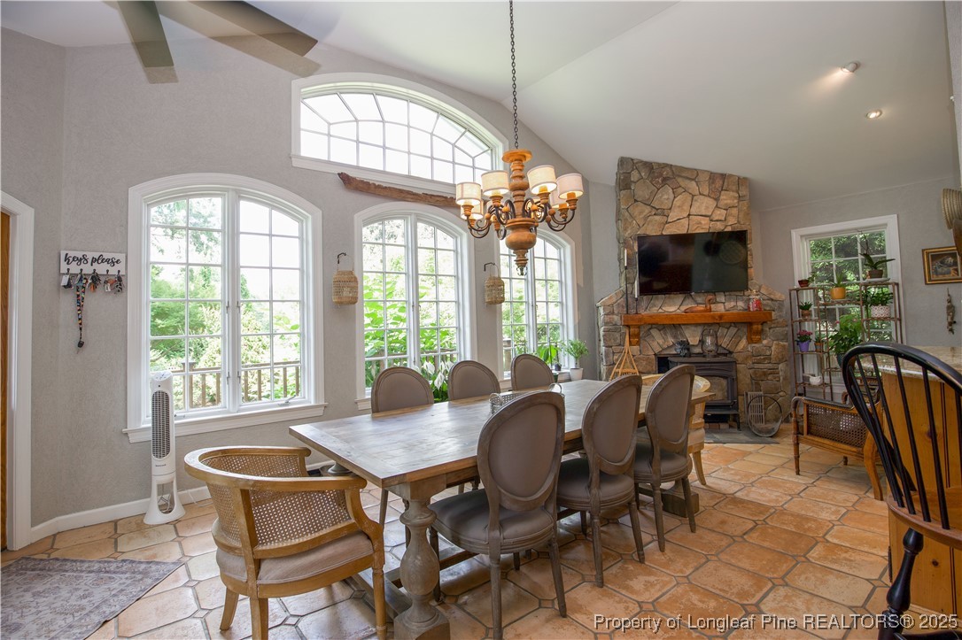 200 Cameron Avenue Vass, NC 28394 - Photo 15 of 50 a view of a dining room with furniture a chandelier and wooden floor