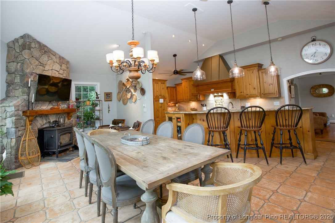 200 Cameron Avenue Vass, NC 28394 - Photo 16 of 50 a view of a dining room and livingroom with furniture wooden floor a chandelier