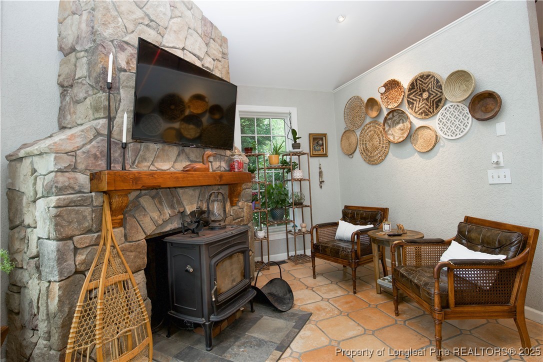 200 Cameron Avenue Vass, NC 28394 - Photo 17 of 50 a living room with a couch and a flat screen tv
