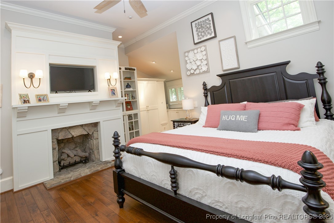 200 Cameron Avenue Vass, NC 28394 - Photo 20 of 50 a bedroom with a bed and a fireplace