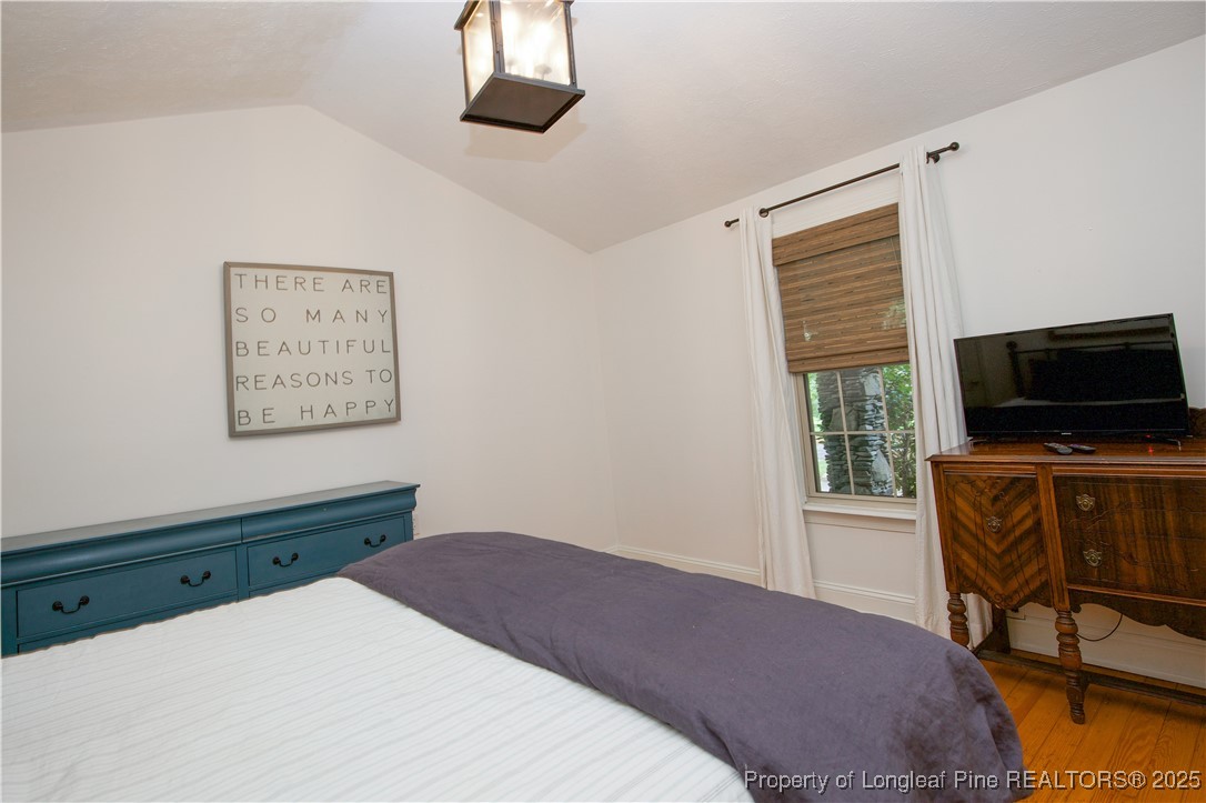 200 Cameron Avenue Vass, NC 28394 - Photo 26 of 50 a bedroom with a bed and a flat screen tv