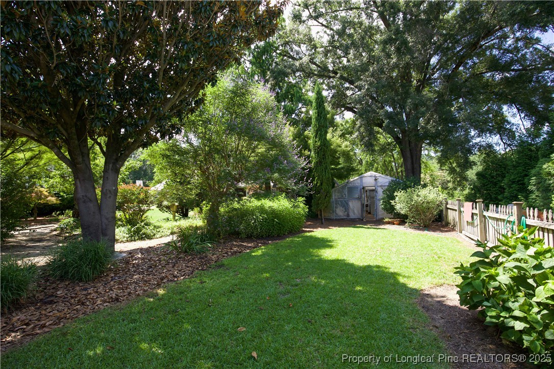 200 Cameron Avenue Vass, NC 28394 - Photo 33 of 50 a view of a backyard with large trees