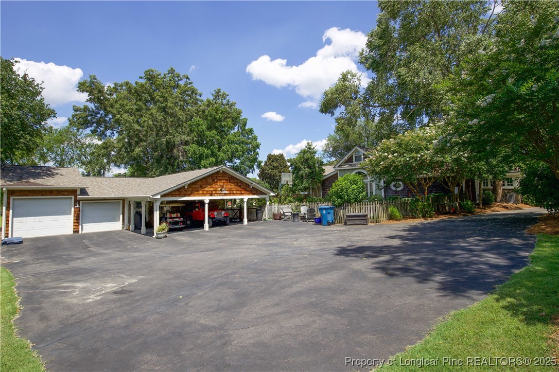 200 Cameron Avenue Vass, NC 28394 - Photo 40 of 50 a front view of a house with a yard and trees
