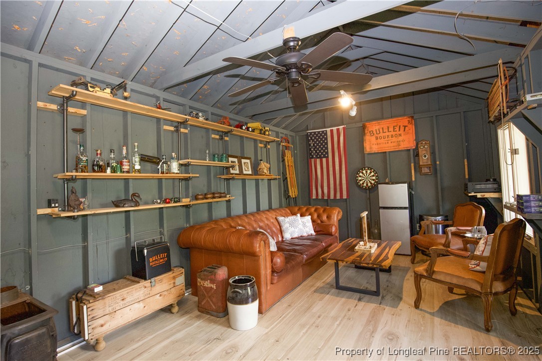 200 Cameron Avenue Vass, NC 28394 - Photo 42 of 50 a outdoor living space with patio furniture and a potted plant