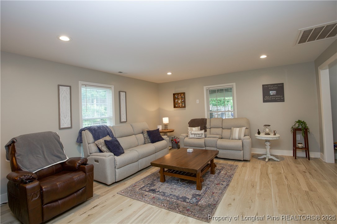 200 Cameron Avenue Vass, NC 28394 - Photo 44 of 50 a living room with furniture and a couch