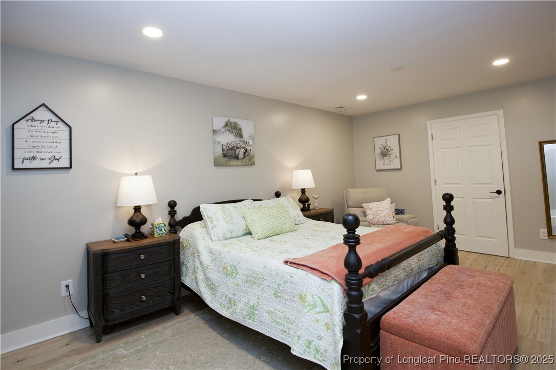 200 Cameron Avenue Vass, NC 28394 - Photo 49 of 50 a bedroom with two beds and painting on the wall