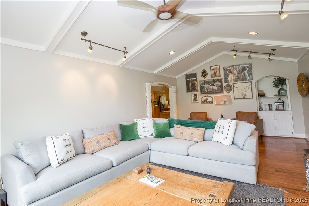 200 Cameron Avenue Vass, NC 28394 - Photo 6 of 50 a living room with furniture and a chandelier