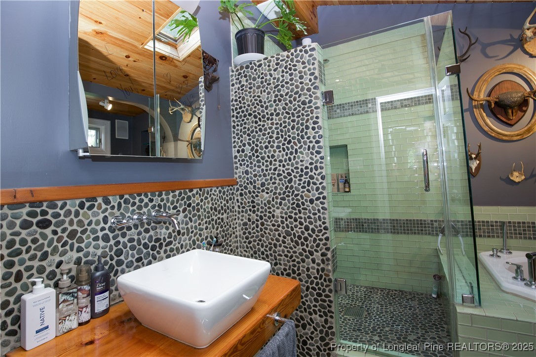 200 Cameron Avenue Vass, NC 28394 - Photo 8 of 50 a bathroom with a bathtub and shower