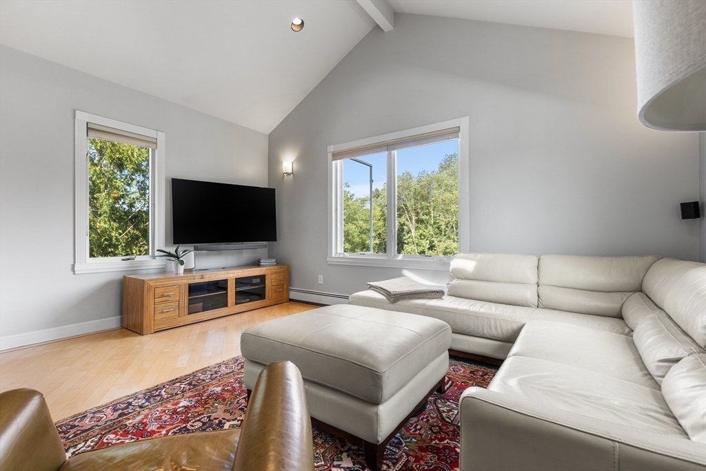409 Haverhill Street Reading, MA 01867 - Photo 14 of 42 a living room with furniture and a flat screen tv