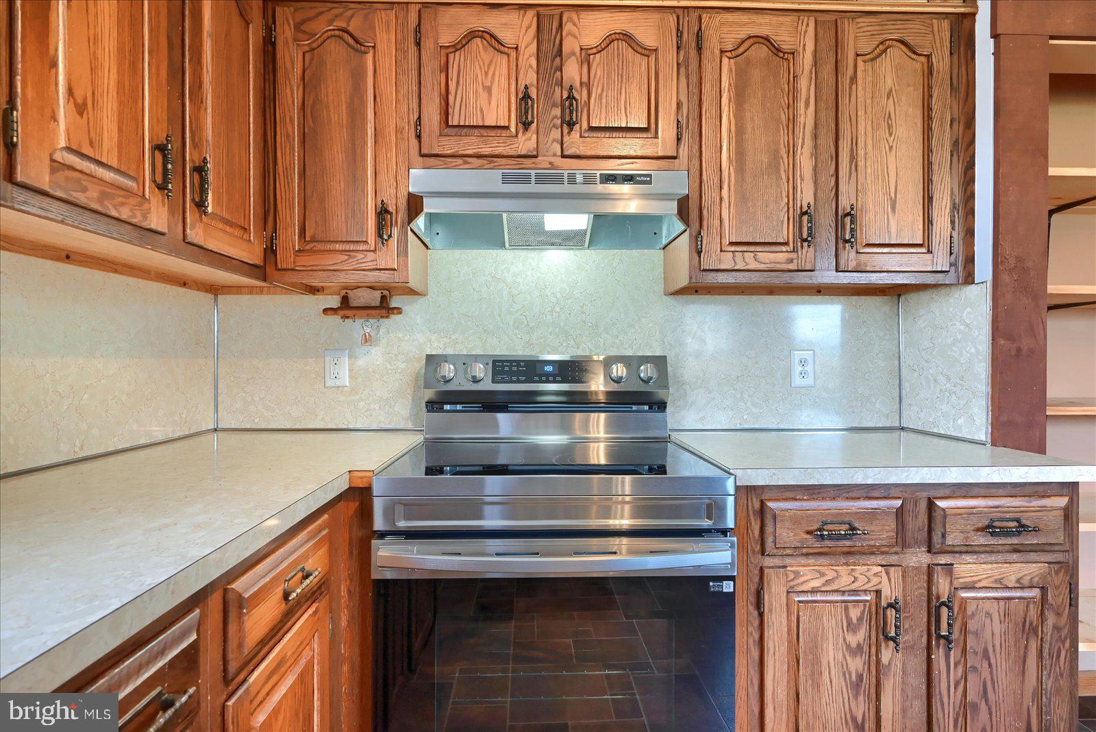1144 Centennial Road New Oxford, PA 17350 - Photo 14 of 40 a stove top oven sitting inside of a kitchen