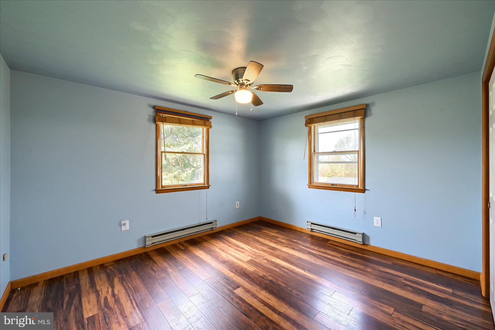 1144 Centennial Road New Oxford, PA 17350 - Photo 19 of 40 wooden floor in an empty room with a window