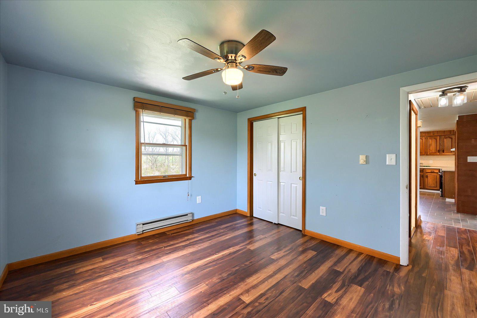 1144 Centennial Road New Oxford, PA 17350 - Photo 20 of 40 wooden floor in an empty room with a window