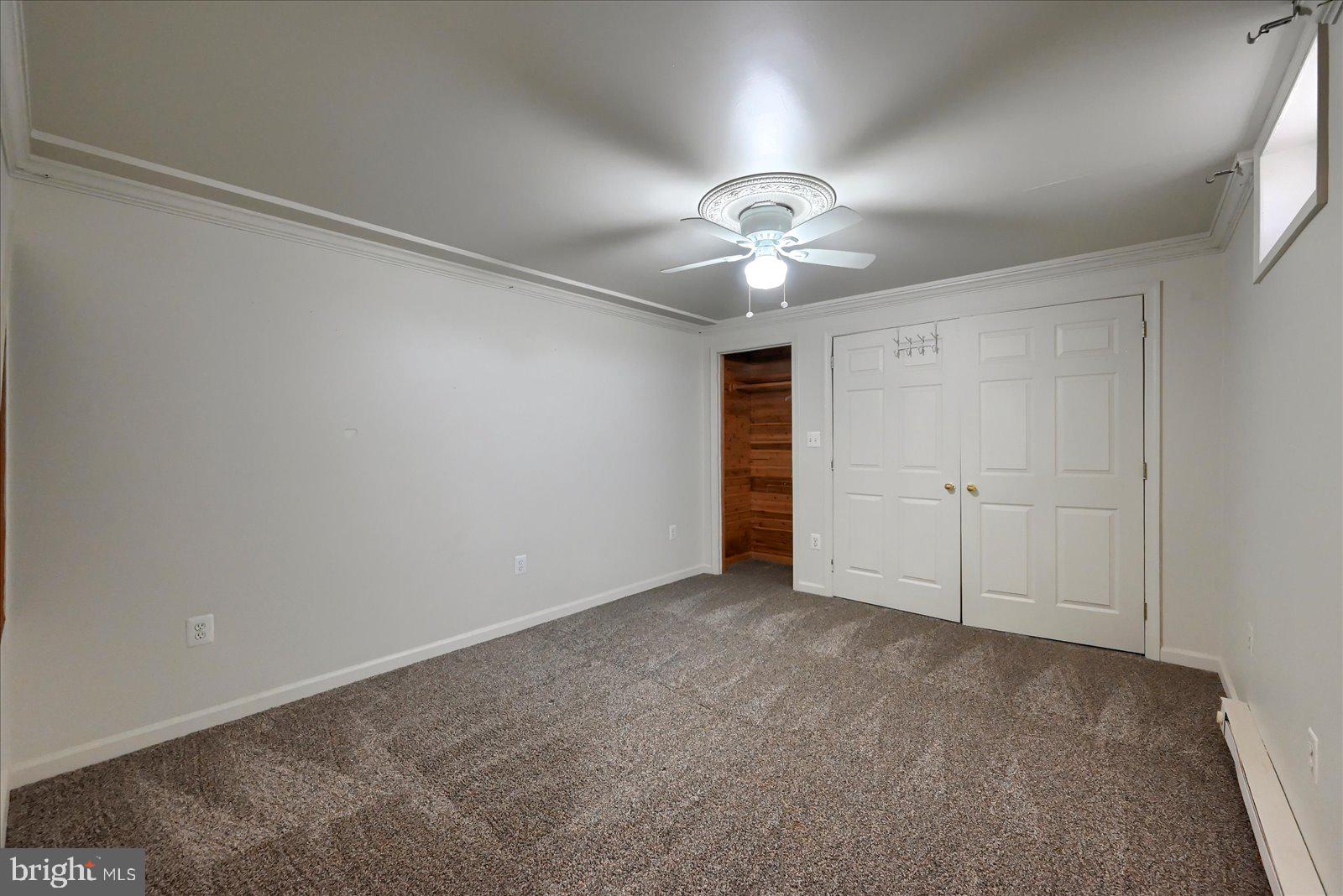 1144 Centennial Road New Oxford, PA 17350 - Photo 23 of 40 an empty room with a empty space and a ceiling fan