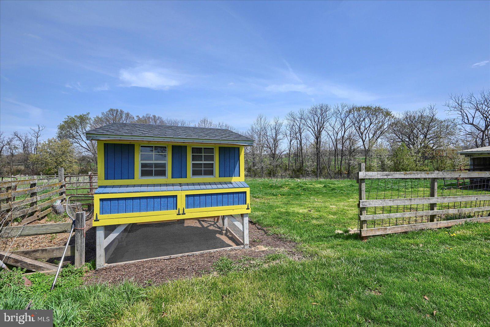 1144 Centennial Road New Oxford, PA 17350 - Photo 33 of 40 a view of a house with a yard table and chairs