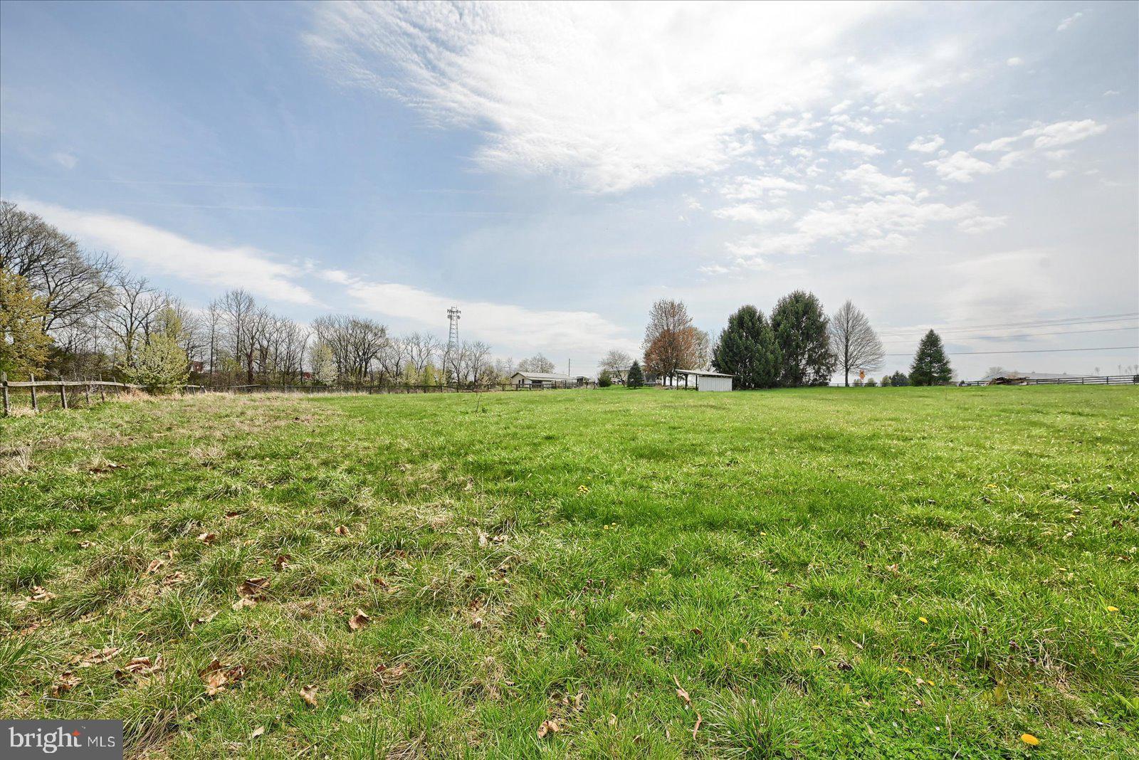 1144 Centennial Road New Oxford, PA 17350 - Photo 36 of 40 a view of a green field with wooden fence