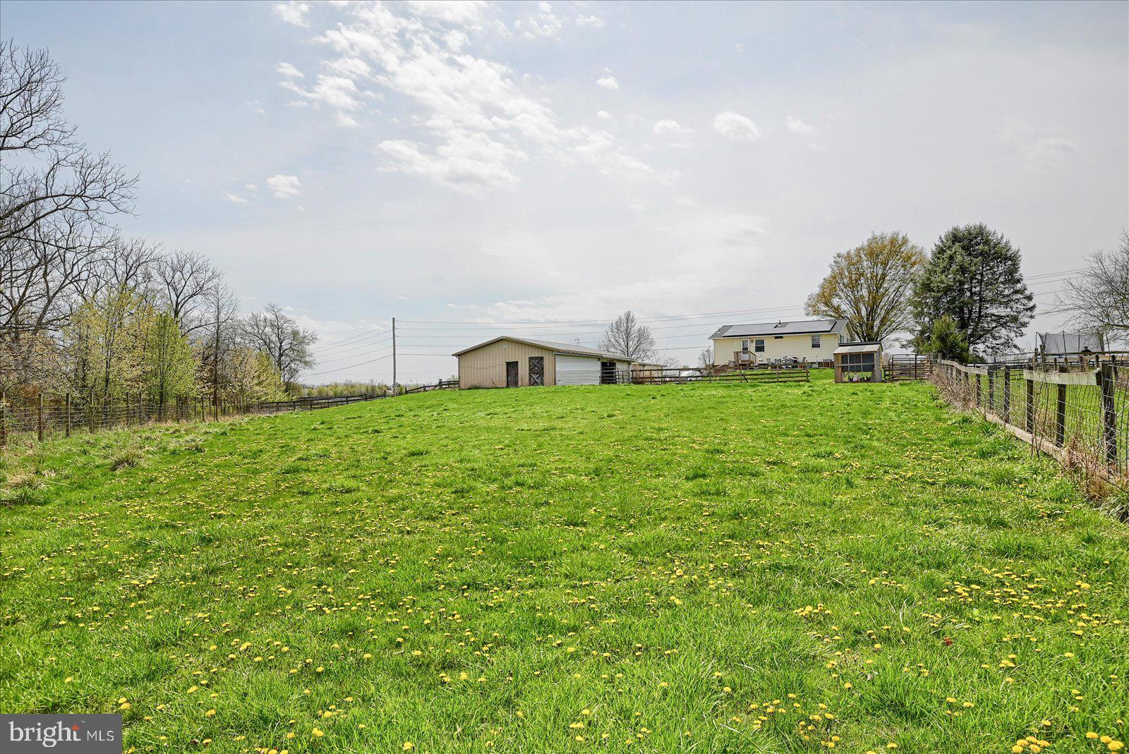 1144 Centennial Road New Oxford, PA 17350 - Photo 38 of 40 a view of a field of grass and trees