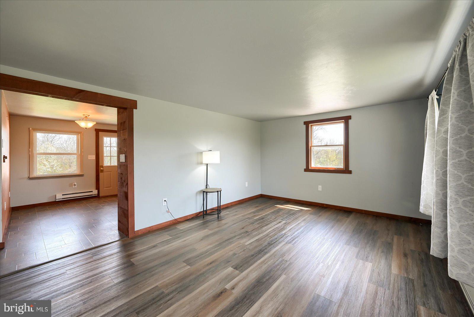 1144 Centennial Road New Oxford, PA 17350 - Photo 9 of 40 an empty room with wooden floor and windows