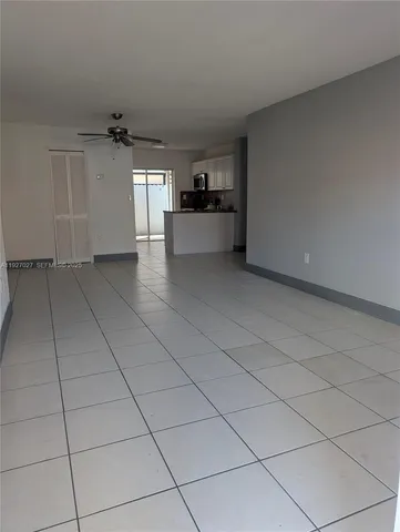 a view of a kitchen with a sink and cabinets