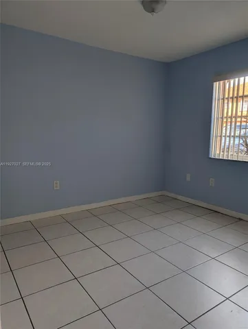 an empty room and window