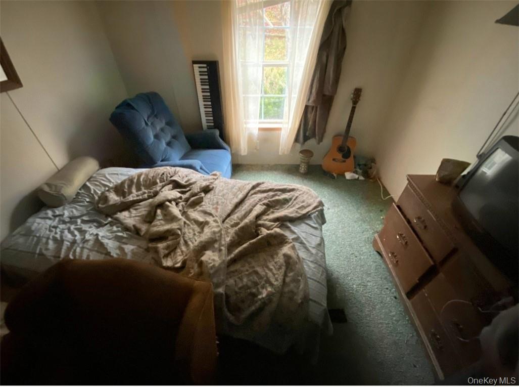 16 Ryan Road Pine Plains, NY 12567 - Photo 13 of 18 a bedroom with a bed lamp and a window