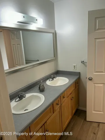 a bathroom with a sink a mirror and a toilet