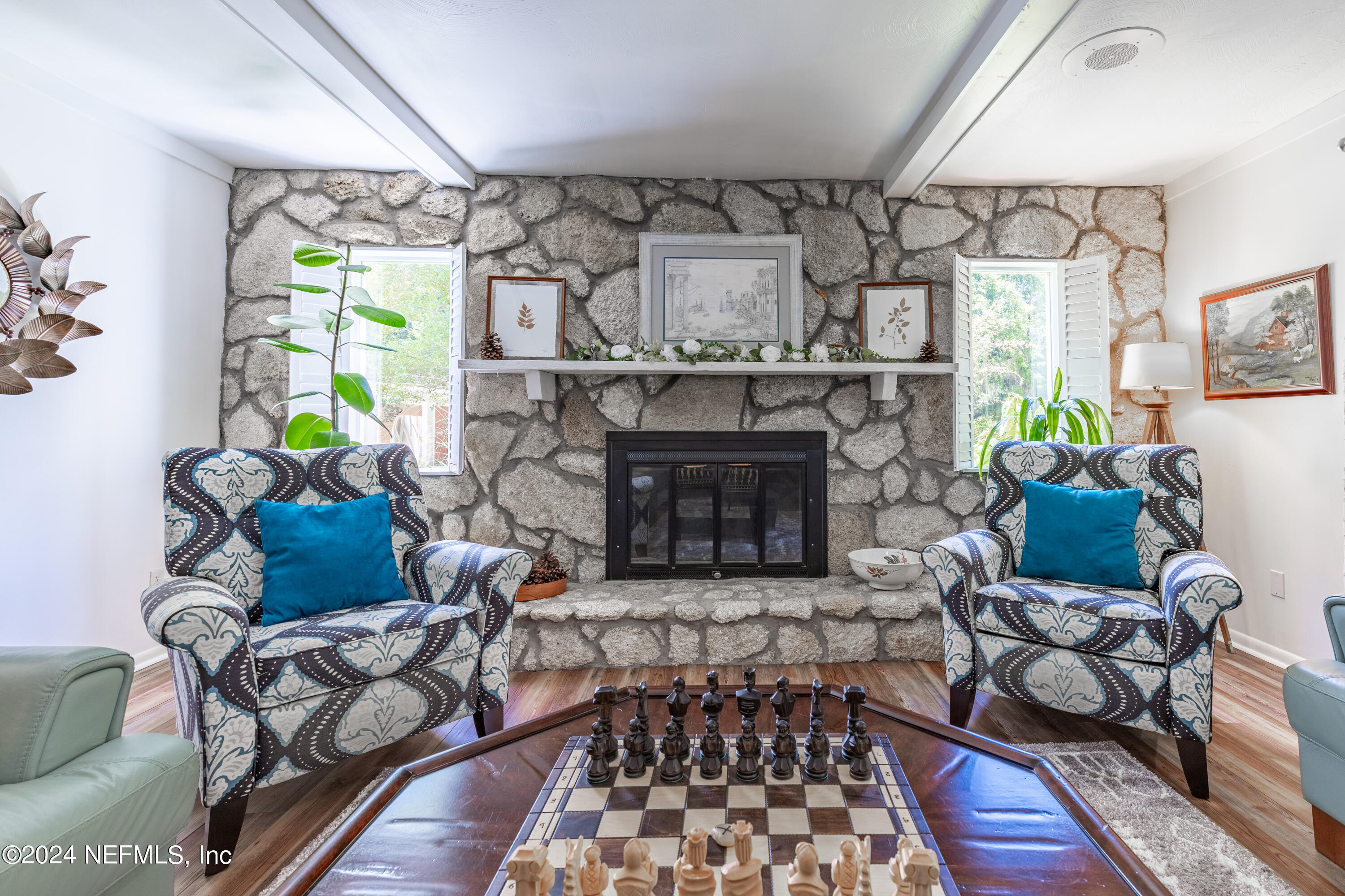 6070 Datil Pepper Road St. Augustine, FL 32086 - Photo 22 of 73 a living room with furniture and a fireplace