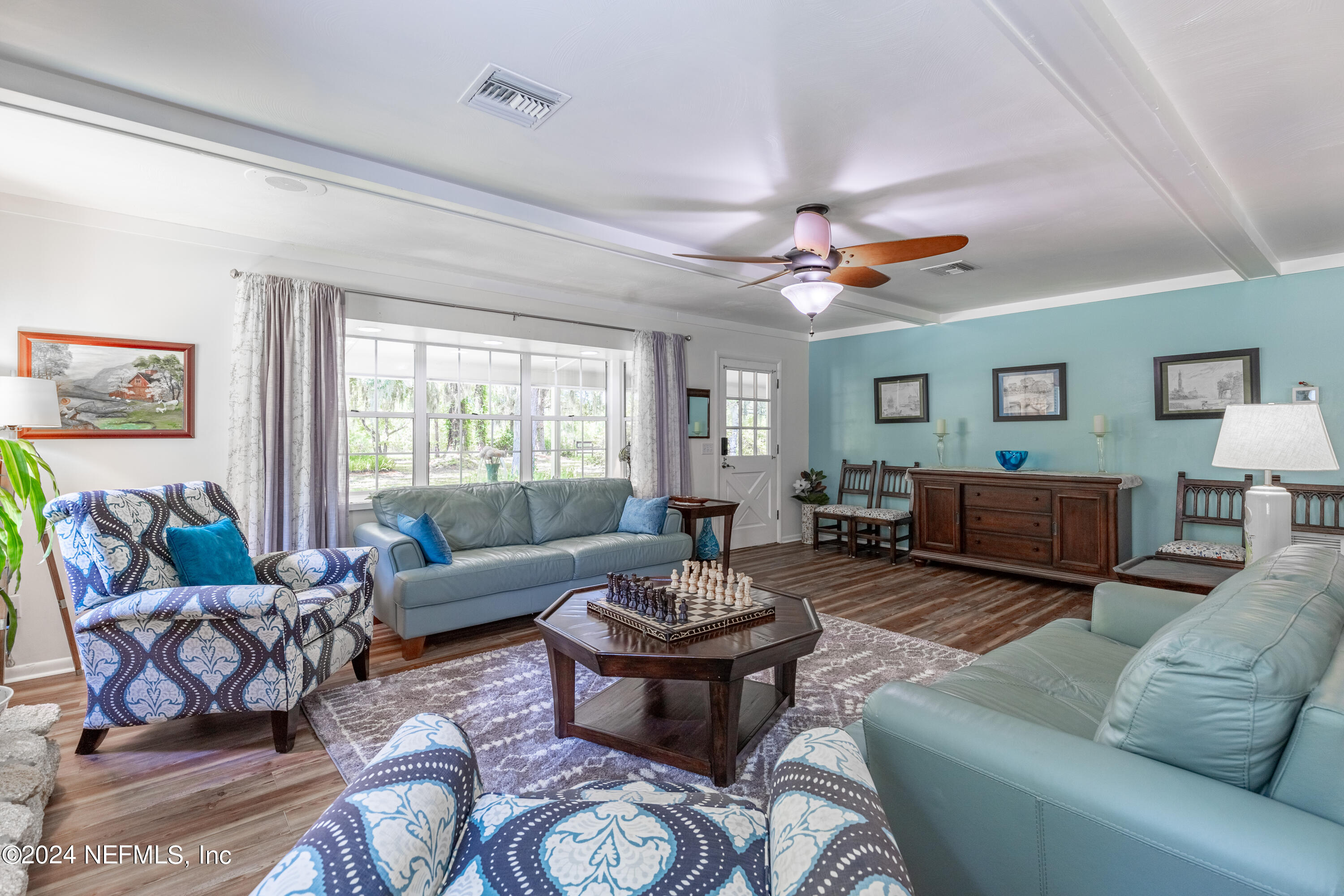6070 Datil Pepper Road St. Augustine, FL 32086 - Photo 24 of 73 a living room with furniture ceiling fan and a window