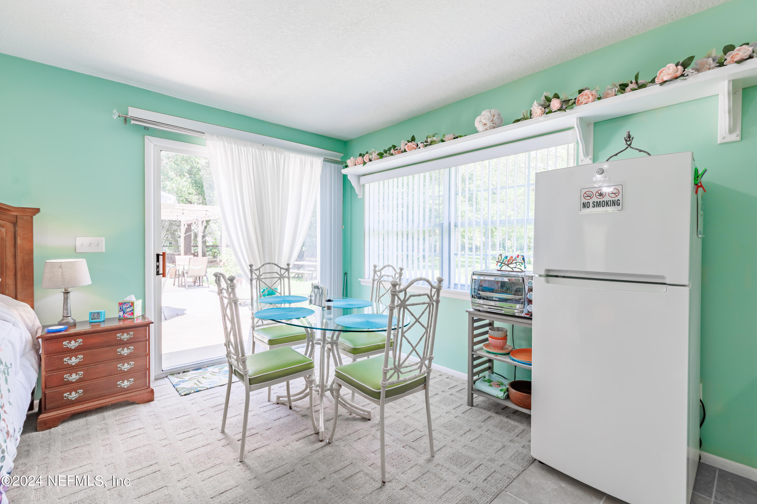 6070 Datil Pepper Road St. Augustine, FL 32086 - Photo 45 of 73 a living room with furniture and a refrigerator