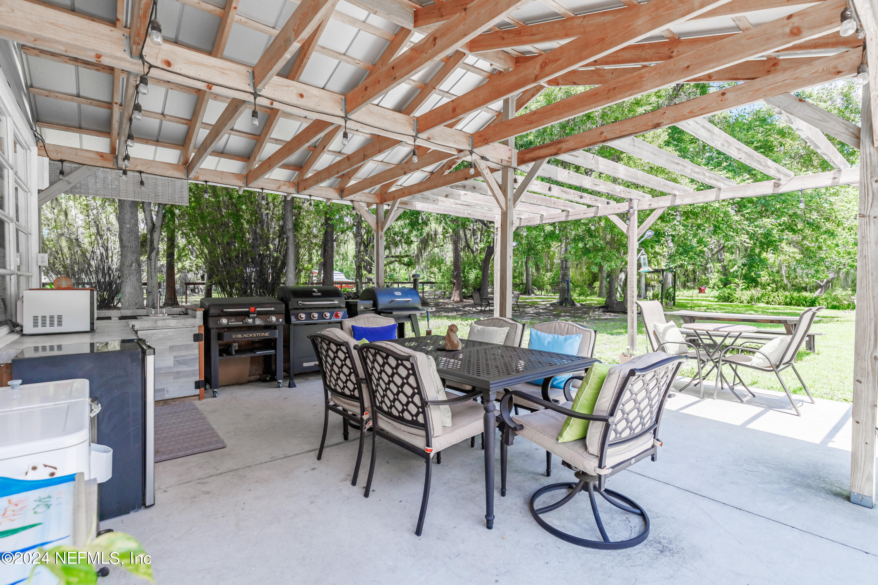 6070 Datil Pepper Road St. Augustine, FL 32086 - Photo 49 of 73 a view of a backyard with a patio and a backyard