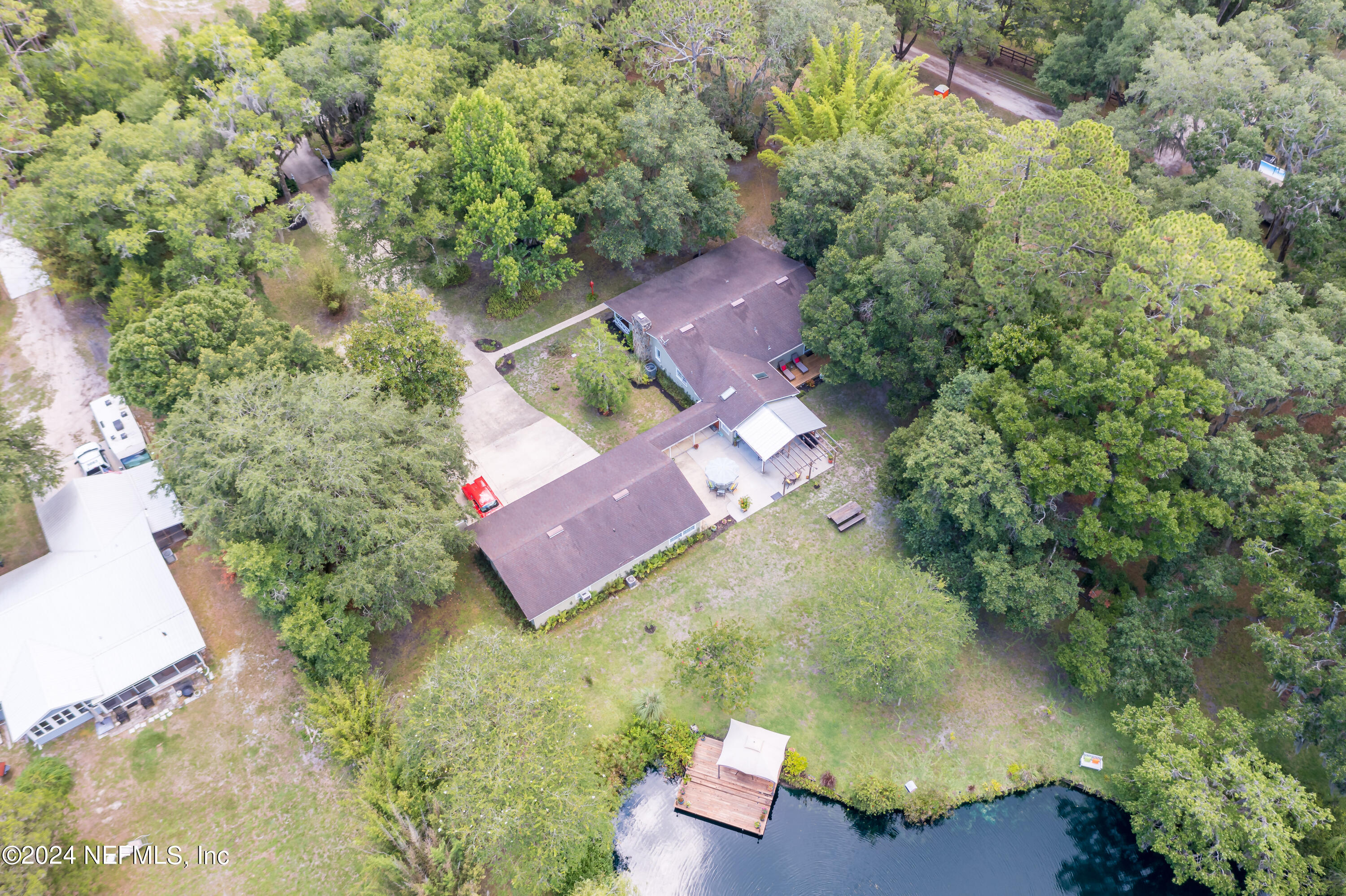 6070 Datil Pepper Road St. Augustine, FL 32086 - Photo 69 of 73 an aerial view of a house with a yard