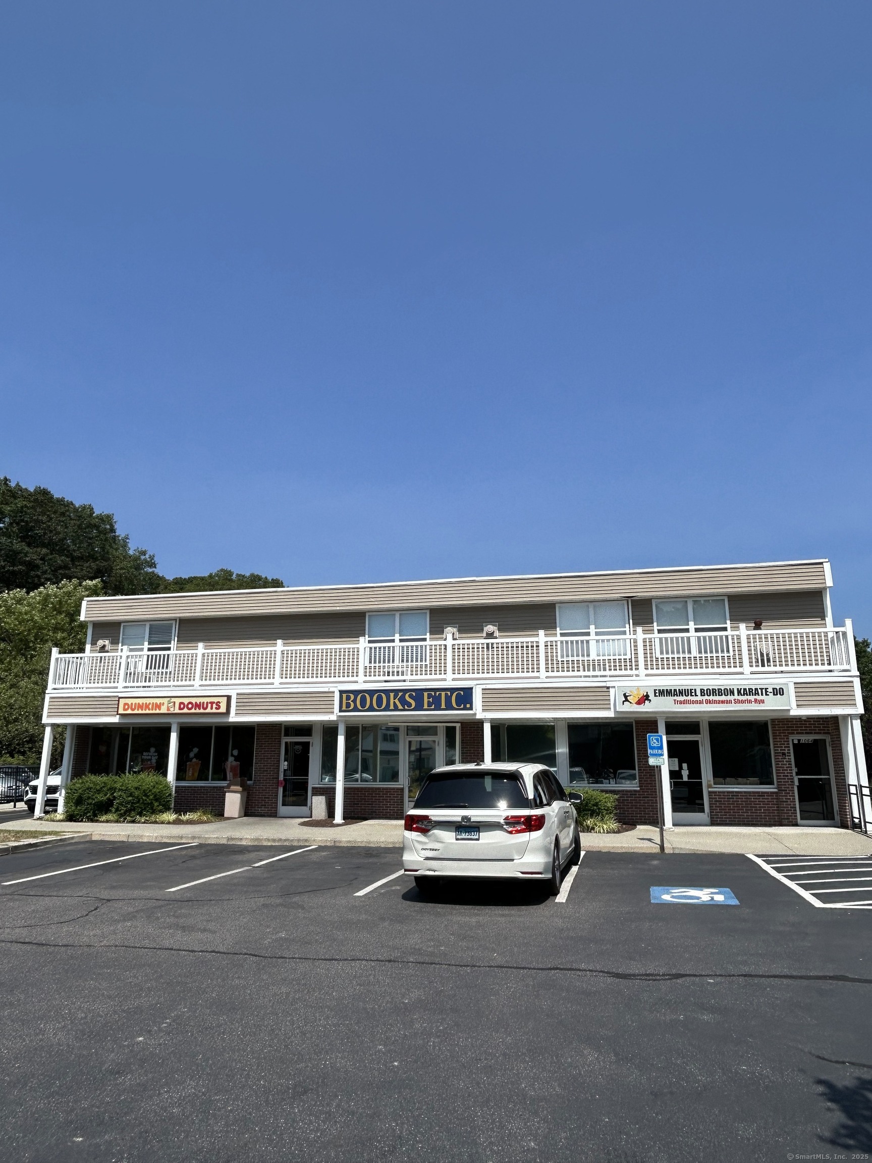 1064 Poquonnock Road, Unit 2 Groton, CT 06340 - Photo 1 of 1 a view of a building with a big yard