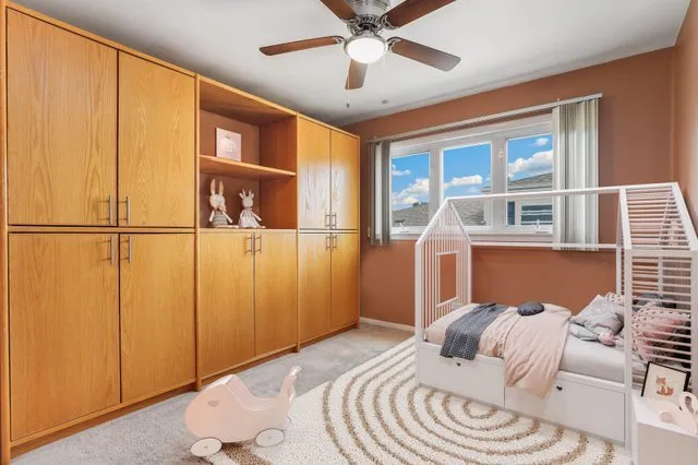 a bed room with a bed and a window