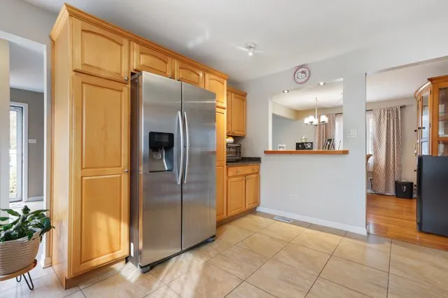 a view of a kitchen with a refrigerator
