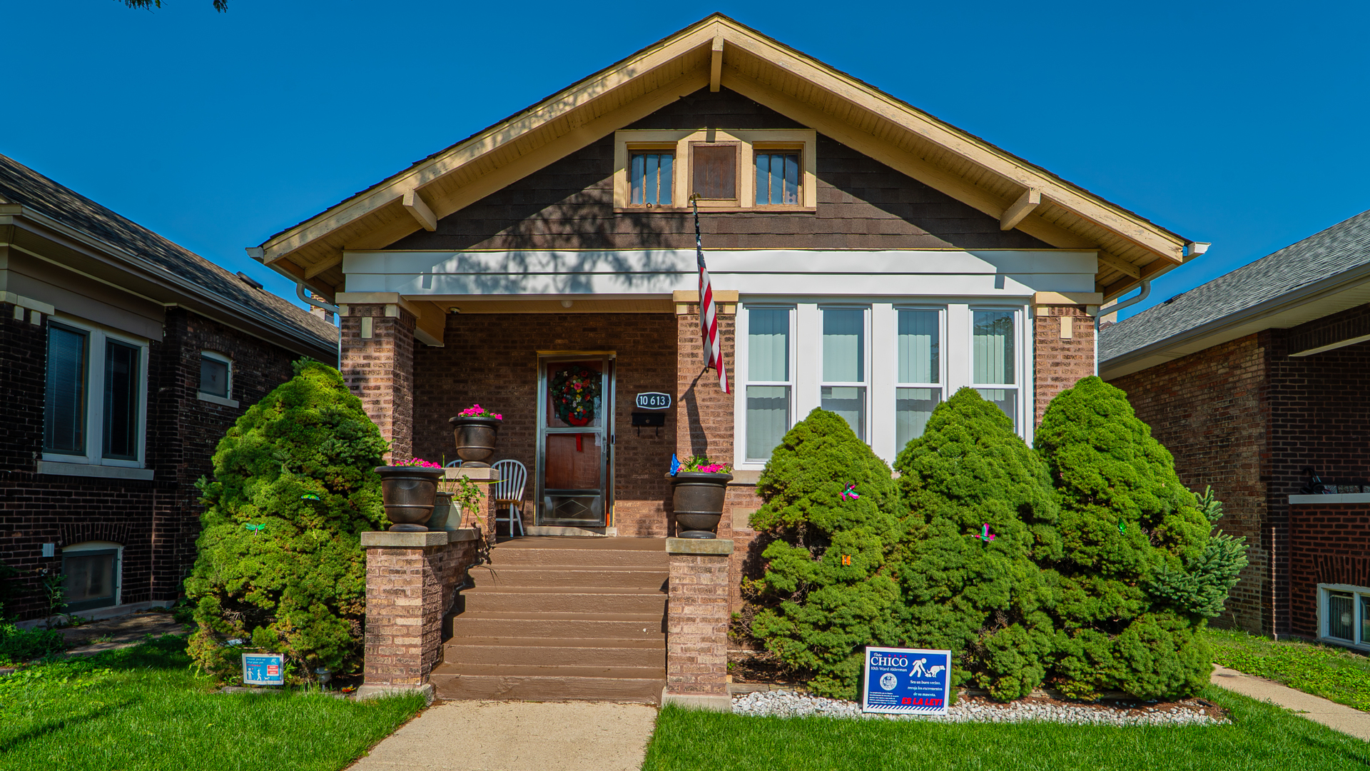 10613 South Ave F Chicago, IL 60617 - Photo 1 of 35 a front view of a house with garden