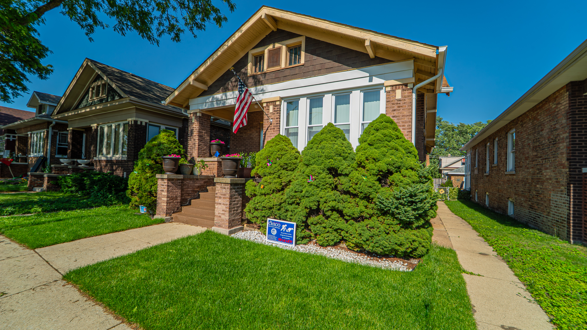 10613 South Ave F Chicago, IL 60617 - Photo 2 of 35 a front view of a house with a yard