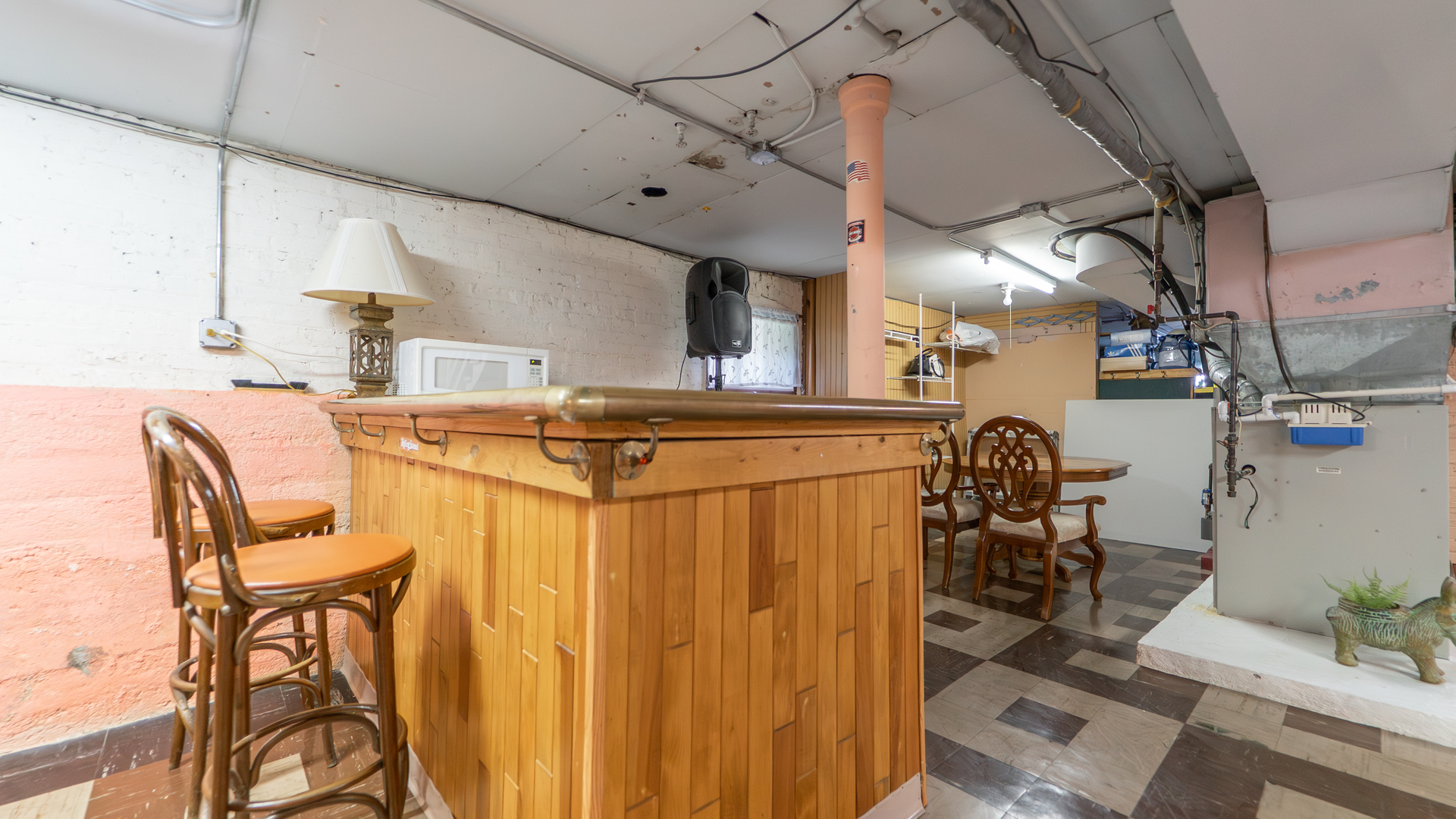 10613 South Ave F Chicago, IL 60617 - Photo 23 of 35 a dining hall with stainless steel appliances a dining table and chairs with wooden floor
