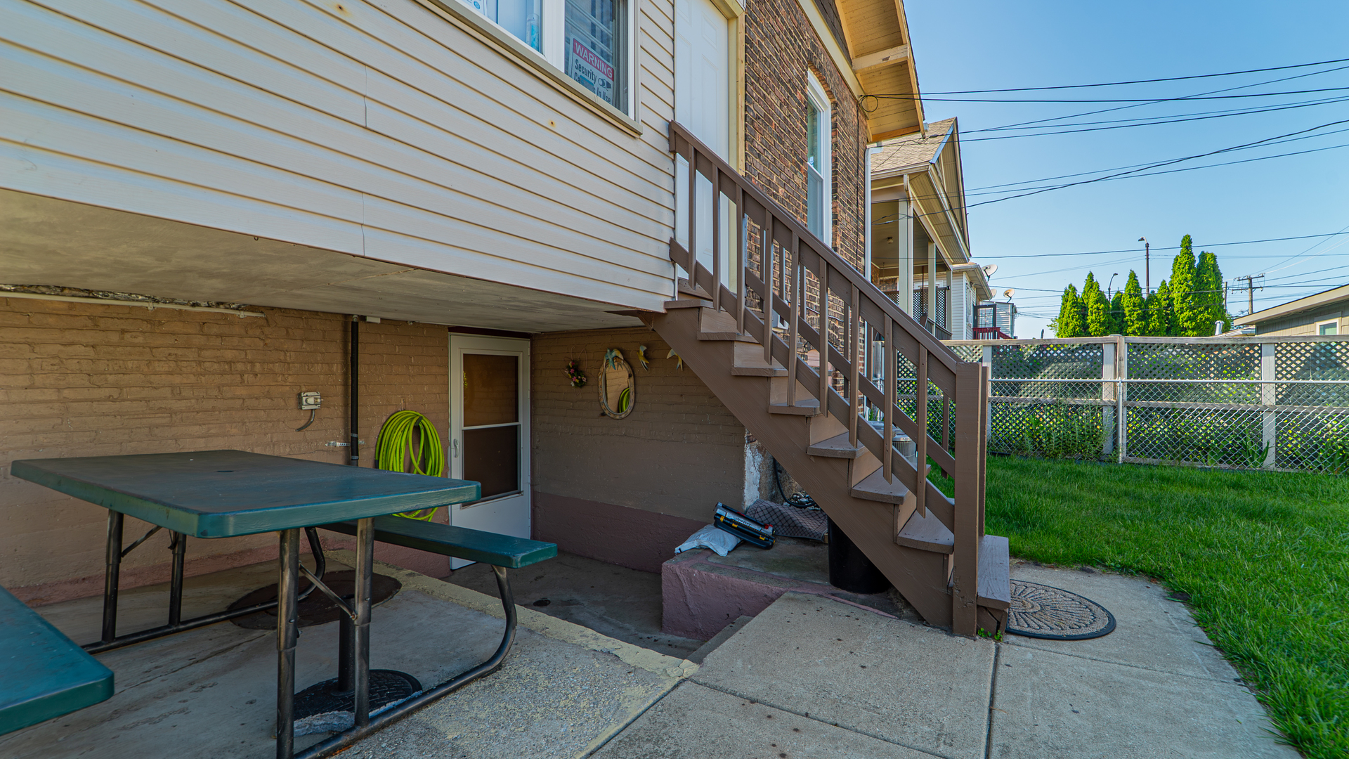 10613 South Ave F Chicago, IL 60617 - Photo 29 of 35 a view of backyard with outdoor seating and stairs