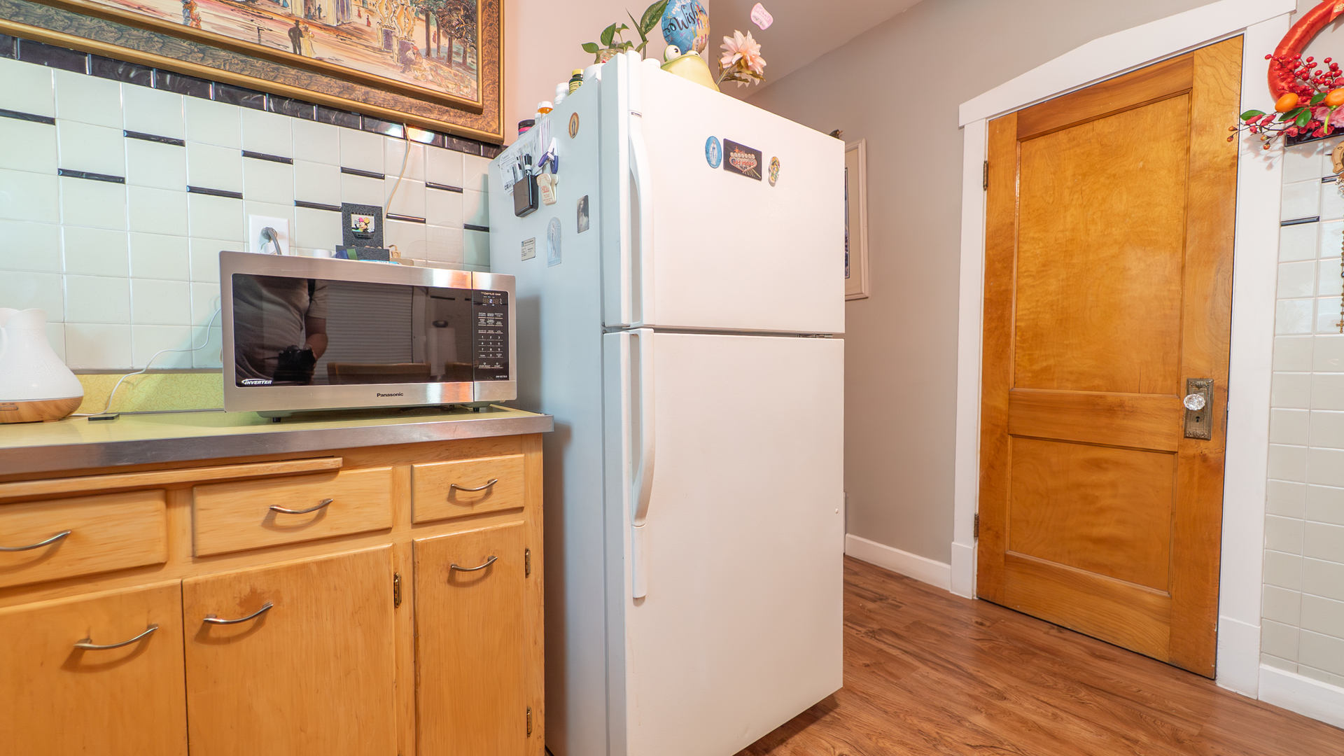 10613 South Ave F Chicago, IL 60617 - Photo 10 of 35 a white refrigerator freezer sitting inside of a kitchen