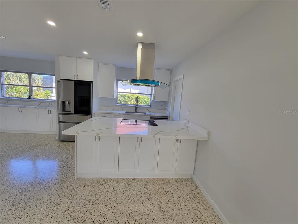 1732 Boca Raton Court Punta Gorda, FL 33950 - Photo 36 of 64 a kitchen with stainless steel appliances a stove a refrigerator and microwave