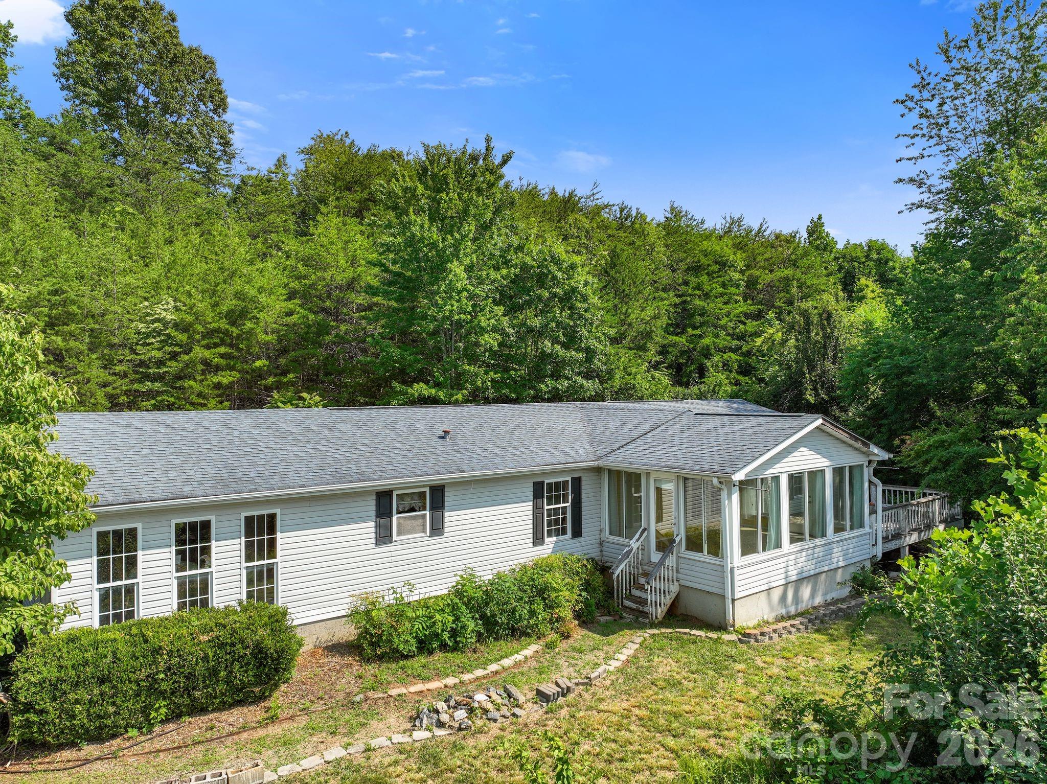 133 Spivey Mountain Road Asheville, NC 28806 - Photo 34 of 40 a front view of a house with a yard
