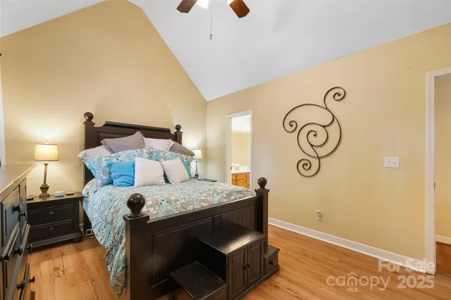 a bed room with a bed and a wall painting