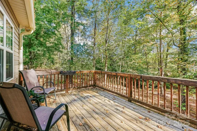 a view of a chair and tables on the roof deck