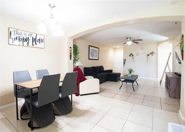a living room with furniture and a table