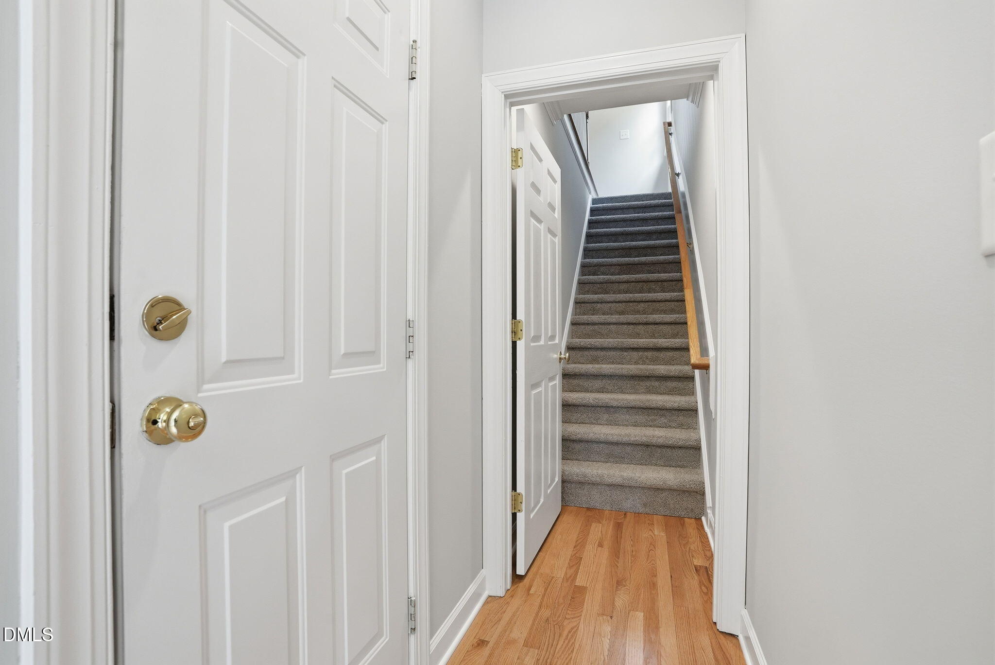 7 Morgans Ridge Lane Durham, NC 27707 - Photo 32 of 75 a view of a hallway with wooden floor and staircase